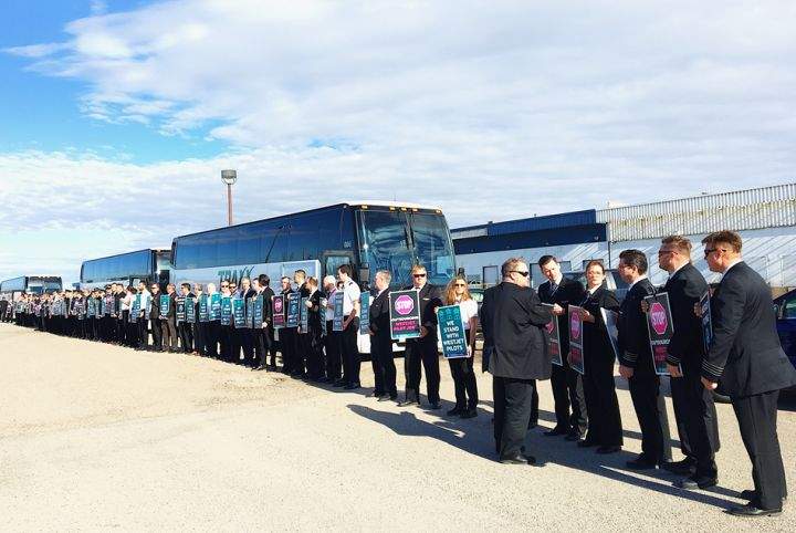 About 150 pilots in uniform all lined up outside WestJet’s headquarters in Calgary on Tuesday morning to show they are serious about encouraging management to negotiate a fair contract.