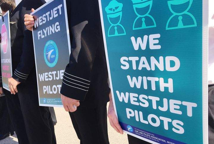 About 150 pilots in uniform all lined up outside WestJet’s headquarters in Calgary on Tuesday morning to show they are serious about encouraging management to negotiate a fair contract.