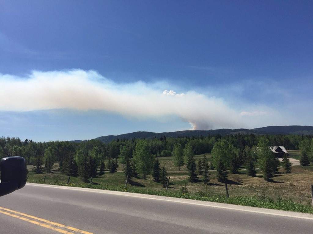 Large plumes of smoke could be seen from a distance as firefighters battle a wildfire near Bragg Creek.