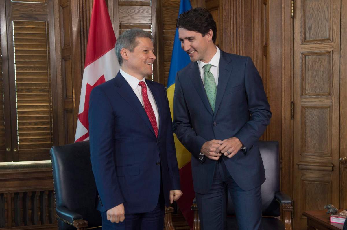 Prime Minister Justin Trudeau speaks with Romanian Prime Minister Dacian Ciolos on Parliament Hill in Ottawa, Wednesday June 15, 2016. THE CANADIAN PRESS/Adrian Wyld