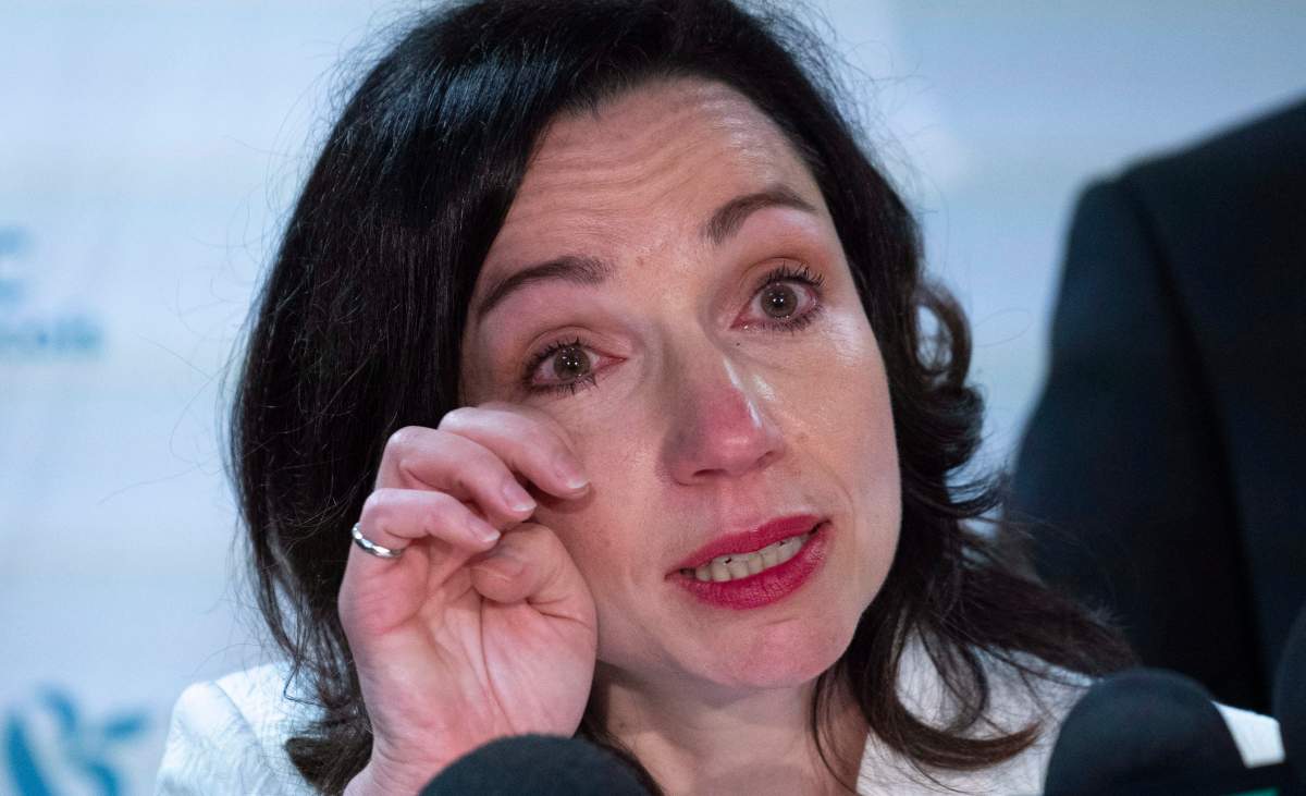 Martine Ouellet wipes a tear during a news conference in Montreal on Monday, June 4, 2018. Ouellet announced she is stepping down as head of the Bloc Québécois after a resounding defeat in a weekend leadership vote. 