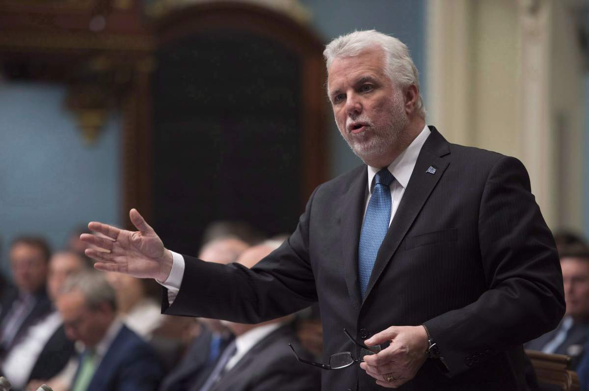 Quebec Premier Philippe Couillard responds to the oppositions over dairy farmers, Wednesday, June 13, 2018 at the legislature in Quebec City. Quebec Premier Philippe Couillard will be heading to the United States next week to push back against U.S. President Donald Trump's protectionist trade policies.