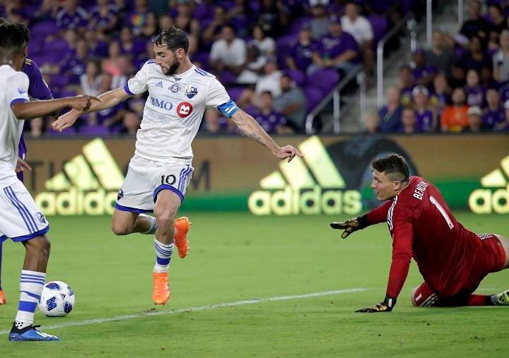 Montreal Impact midfielder Ignacio Piatti (10) makes a goal past Orlando City goalkeeper Joseph Bendik (1) during the second half of an MLS soccer match, Saturday, June 23, 2018, in Orlando, Fla. 