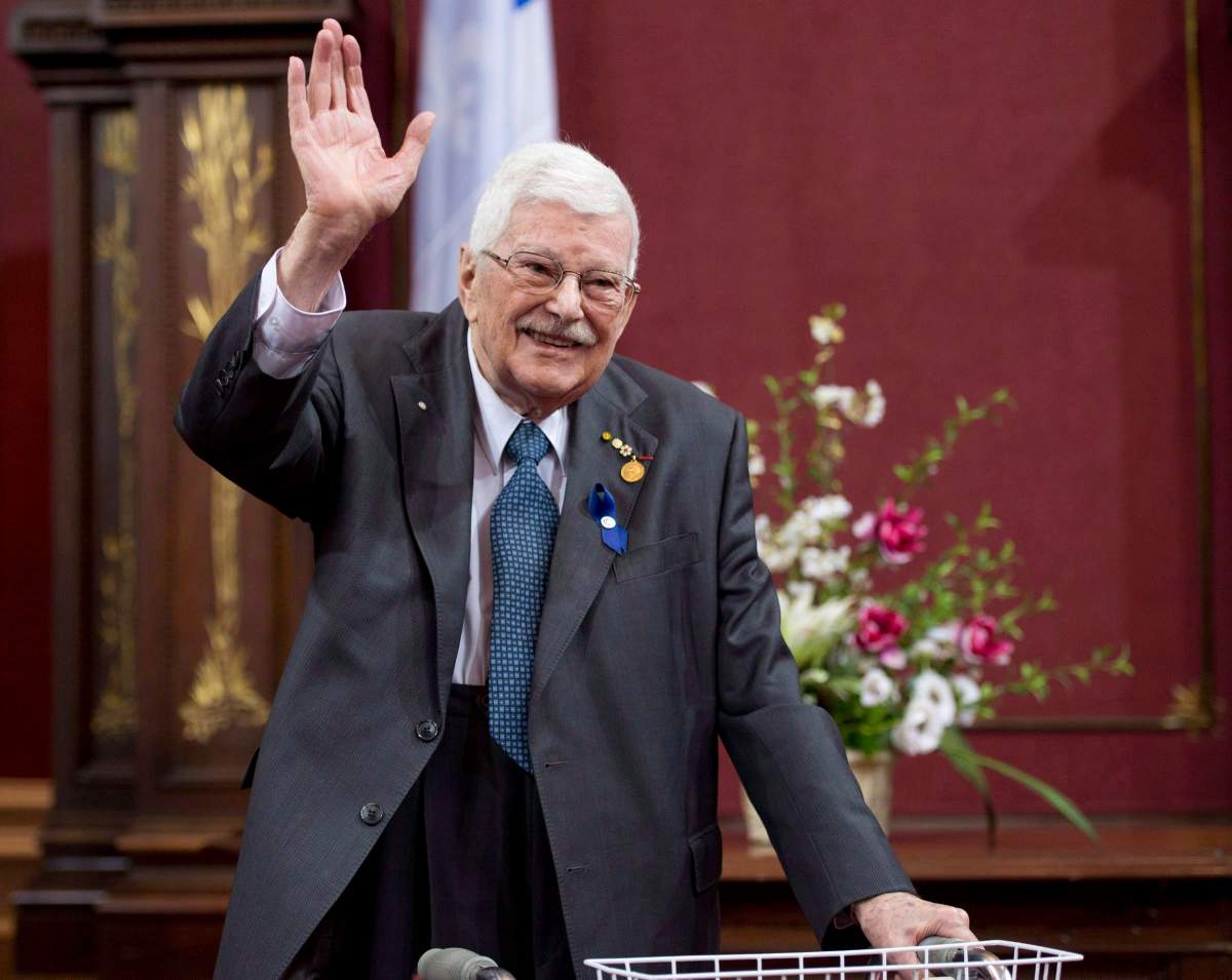 Former Quebec education minister Paul Gerin-Lajoie waves as he receives the George-Emile-Lapalme award at a ceremony for Les Prix du Quebec, Tuesday, November 12, 2013 at the legislature in Quebec City. 
