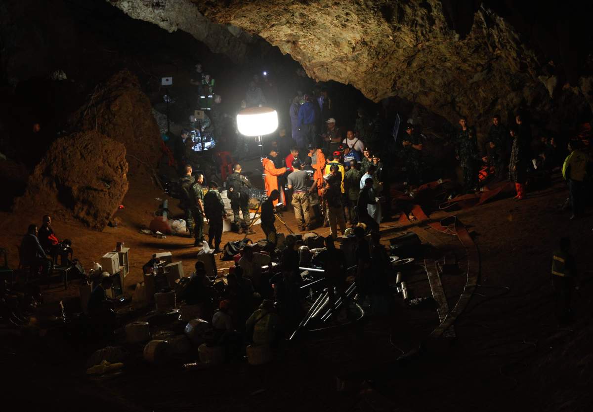 Thai military officials, the rescue workers and park officials inform associated officials of their plan in regards to the rescue operation for missing football players and their coach at the Tham Luang cave in Tham Luang Khun Nam Nang Noon Forest Park in Chiang Rai province, Thailand, June 27, 2018.