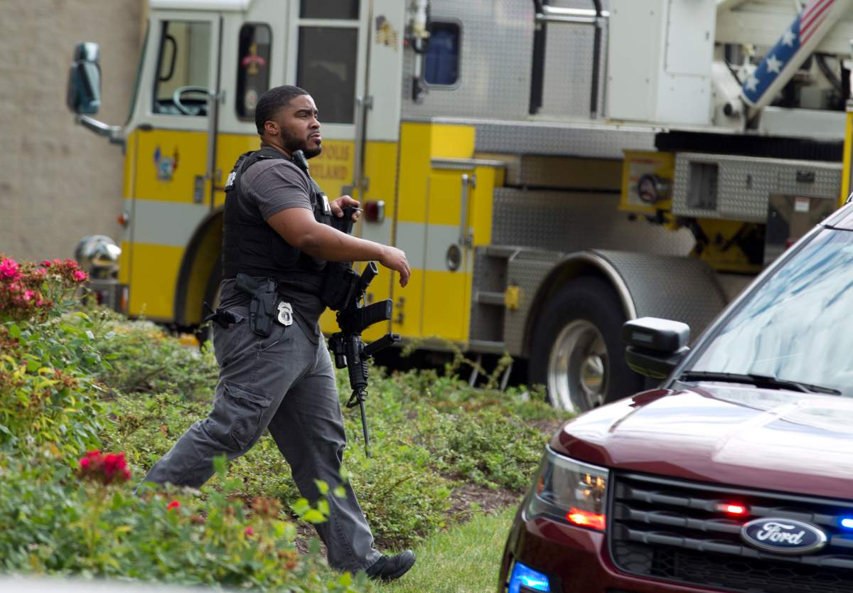Maryland police officers patrol the area after multiple people were shot at a newspaper in Annapolis, Md., Thursday, June 28, 2018. (AP Photo/Jose Luis Magana).