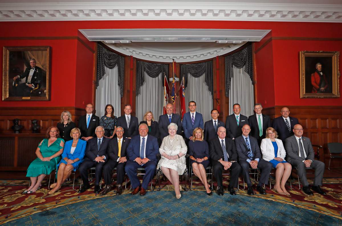 Incoming Ontario Premier Doug Ford sits with members of his cabinet prior to being sworn in during a ceremony at Queen’s Park in Toronto on Friday, June 29, 2018.
