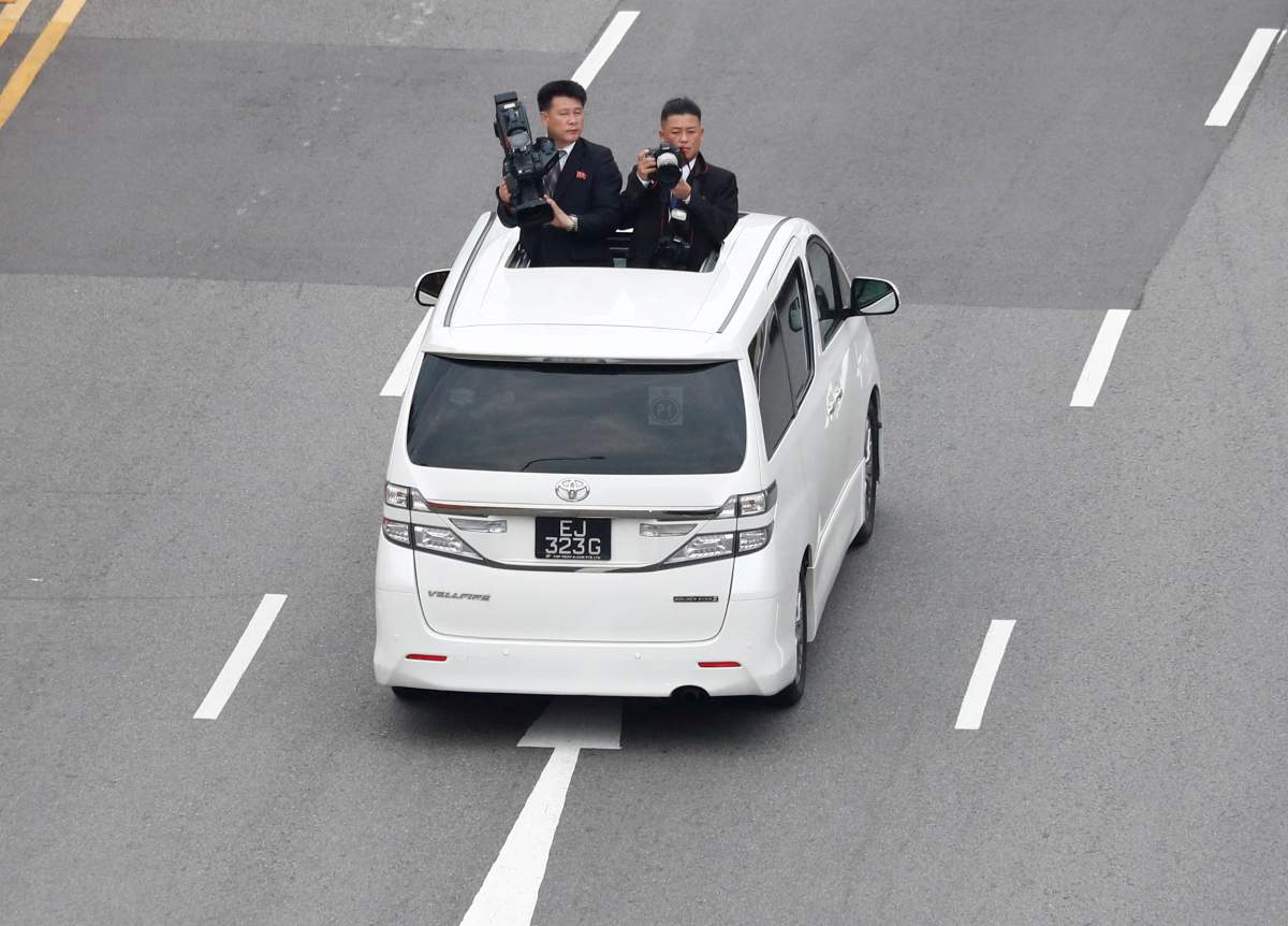 FILE PHOTO: North Korean media travel with the motorcade of North Korean leader Kim Jong Un towards Sentosa for his meeting with U.S. President Donald Trump, in Singapore June 12, 2018.