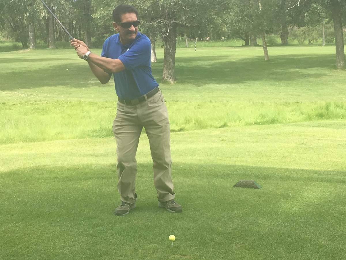 Golfer Shabu Hussein, who is blind, teeing it up at Inglewood Golf Club in Calgary on June 28, 2018.