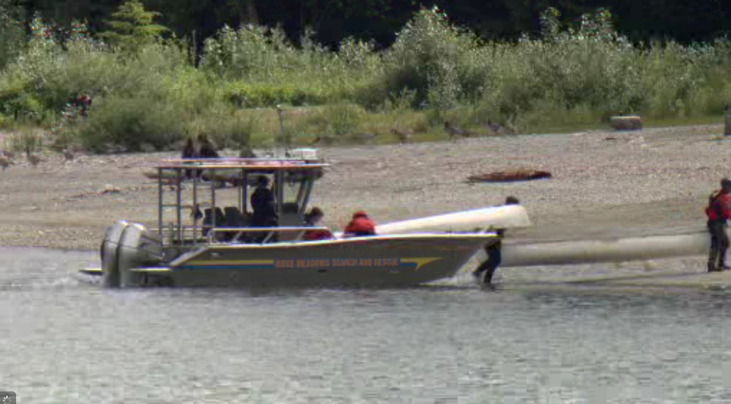 Ridge Meadows Search and Rescue crews unload canoes from a girl guide troupe who became stranded on Alouette Lake. 