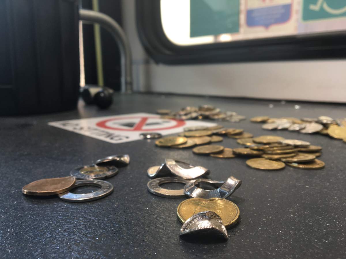 Calgary Transit collects piles of foreign coins and tokens that have no real value.