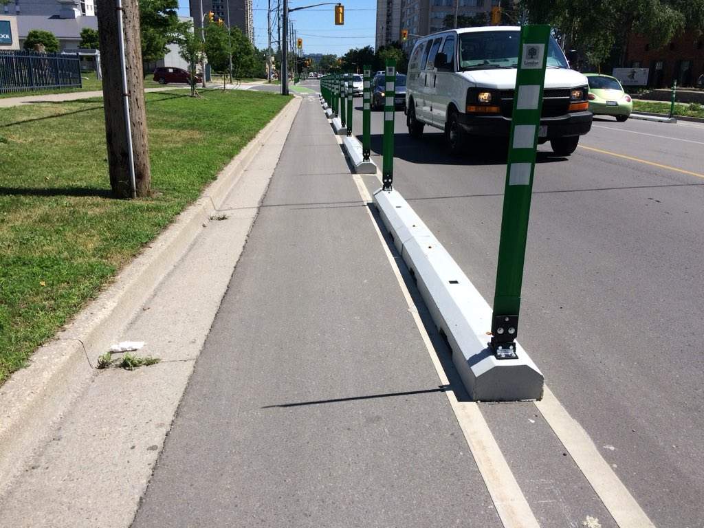 These barriers separate traffic and cyclists on Colborne Street.