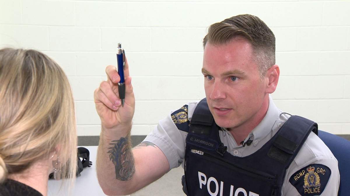 RCMP Const. Chad Morrison performs a test on Alex Noonan, a junior communications officer for the police, as part of a staged drug recognition evaluation for journalists in Dartmouth, N.S., on June 29, 2018.