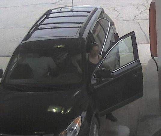 Barrie police are looking to identify a woman (above) accused of stealing gas from a local gas station.