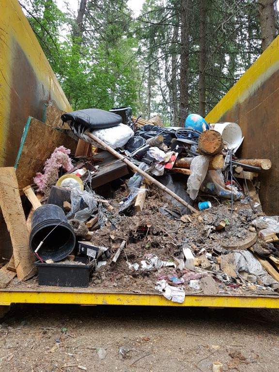 A large, illegal dump site near Peachland cleaned up by volunteers - image