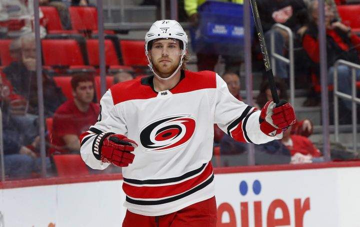 FILE – In this Jan. 20, 2018 file photo Carolina Hurricanes center Elias Lindholm celebrates his goal against the Detroit Red Wings in the first period of an NHL hockey game in Detroit. The Hurricanes have acquired defenseman Dougie Hamilton as part of a blockbuster trade with the Calgary Flames at the NHL draft. Carolina got Hamilton, winger Micheal Ferland and prospect Adam Fox from Calgary for Lindholm and defenseman Noah Hanifin.