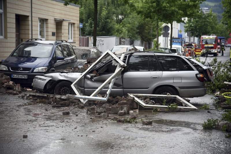 A car is destroyed after an explosion of a house in Wuppertal, Germany, June 24, 2018. German police say 25 people were injured, when an explosion destroyed a several-store building in the western city of Wuppertal.