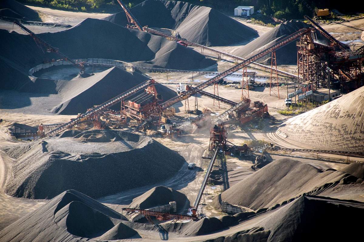 Mining equipment sit at an aggregate mine processing facility in this aerial photograph taken above Caledon, Ont., on Oct. 2, 2017. The demand for sand is on the rise as urban development around the world soars and hydraulic fracturing technology becomes more popular all over the world.
