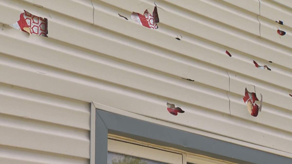 Hail tore through the siding of several homes in Ninette, Man. Thursday.