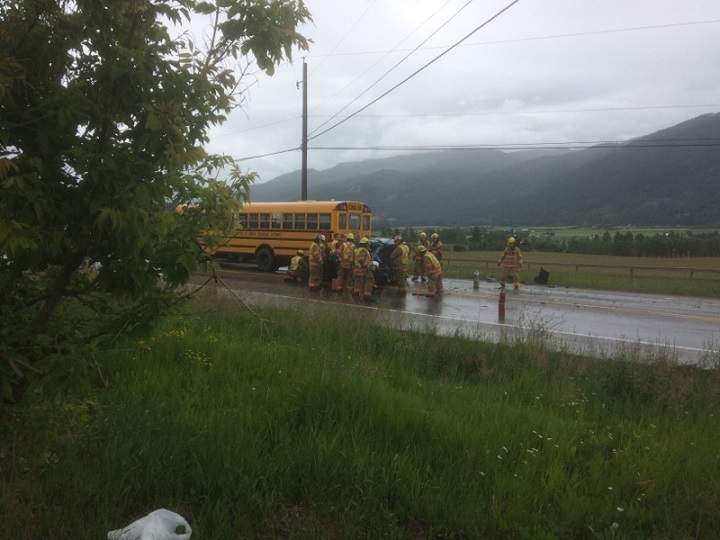Emergency crews surround a vehicle that was involved in a highway crash near Enderby, B.C., on Wednesday afternoon.