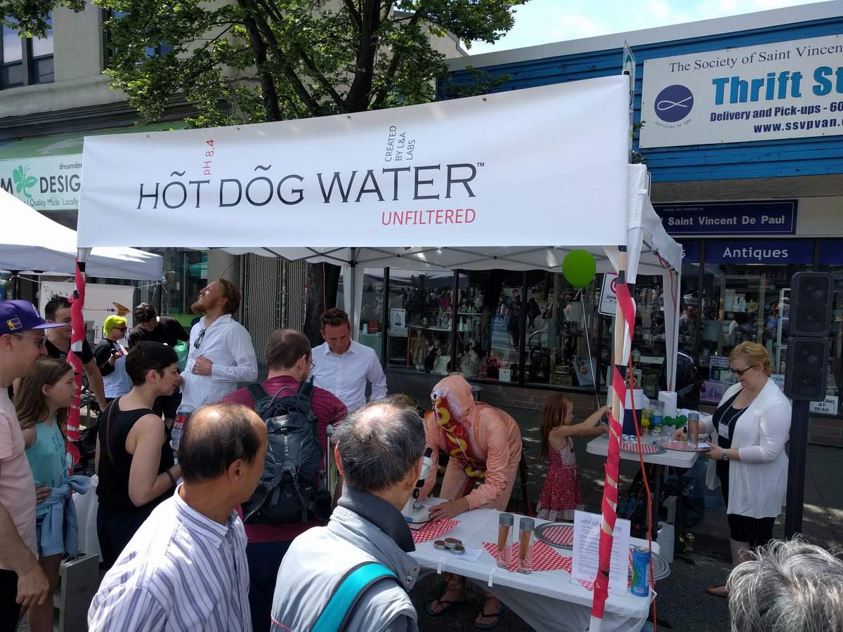 Main Street Car Free Day attendees line up to sample Hot Dog Water.