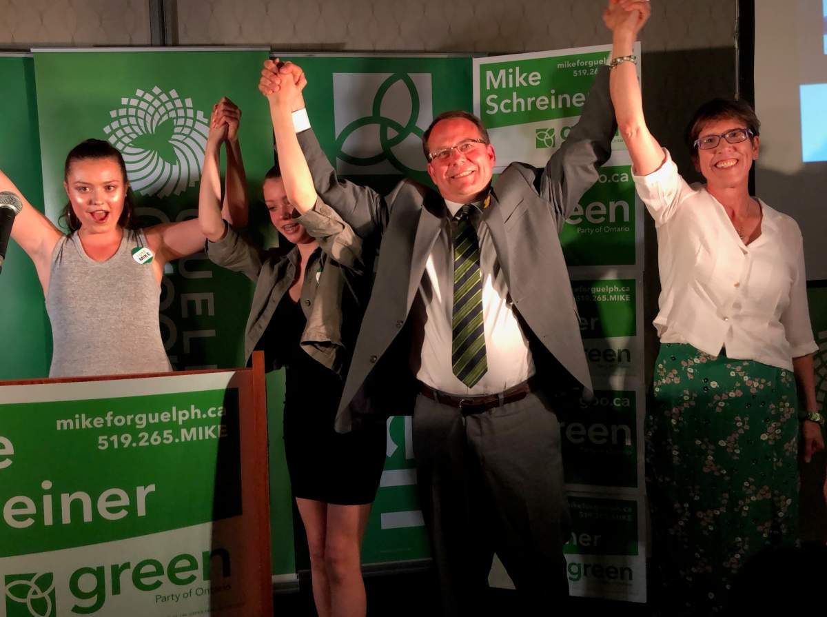 Green Party Leader Mike Schreiner celebrates his election victory with his family in Guelph on Thursday night.