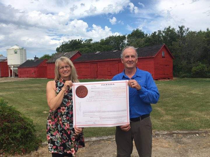 Amy and Maurice Wildeman proudly holding the official land title signed to Tobias Wildeman (Maurice’s grandfather) for the home quarter which Amy and Maurice occupy.