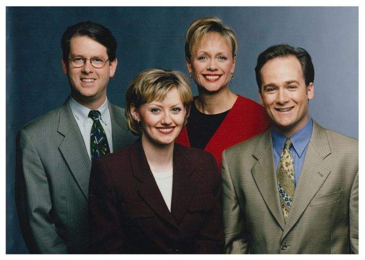Kevin O’Connell, Andrea Engel, Lorraine Mansbridge and Doug Downs pose for a station promo shoot.