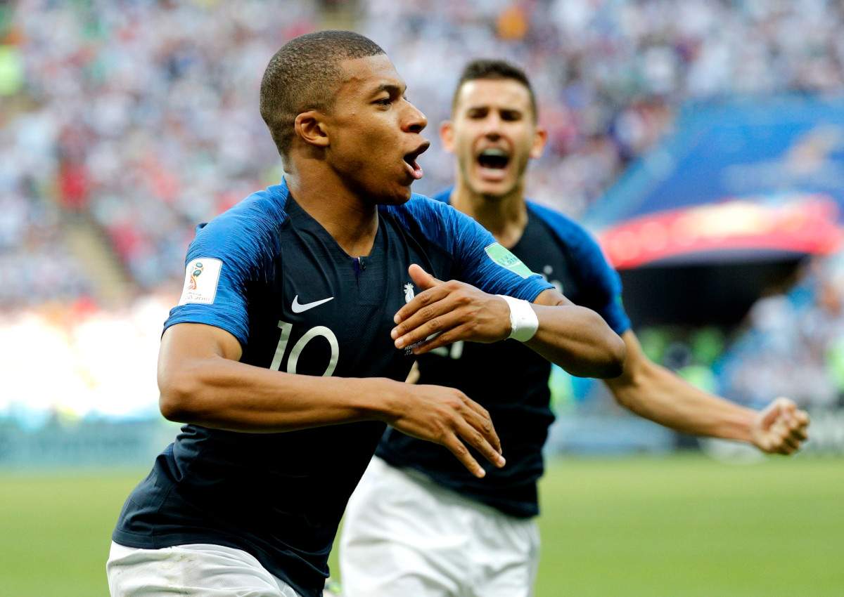 Kylian Mbappe of France celebrates scoring the 3-2 goal during the FIFA World Cup 2018 round of 16 soccer match between France and Argentina in Kazan, Russia, 30 June 2018.

(RESTRICTIONS APPLY: Editorial Use Only, not used in association with any commercial entity - Images must not be used in any form of alert service or push service of any kind including via mobile alert services, downloads to mobile devices or MMS messaging - Images must appear as still images and must not emulate match action video footage - No alteration is made to, and no text or image is superimposed over, any published image which: (a) intentionally obscures or removes a sponsor identification image; or (b) adds or overlays the commercial identification of any third party which is not officially associated with the FIFA World Cup)  EPA/SERGEY DOLZHENKO EDITORIAL USE ONLY  EDITORIAL USE ONLY.
