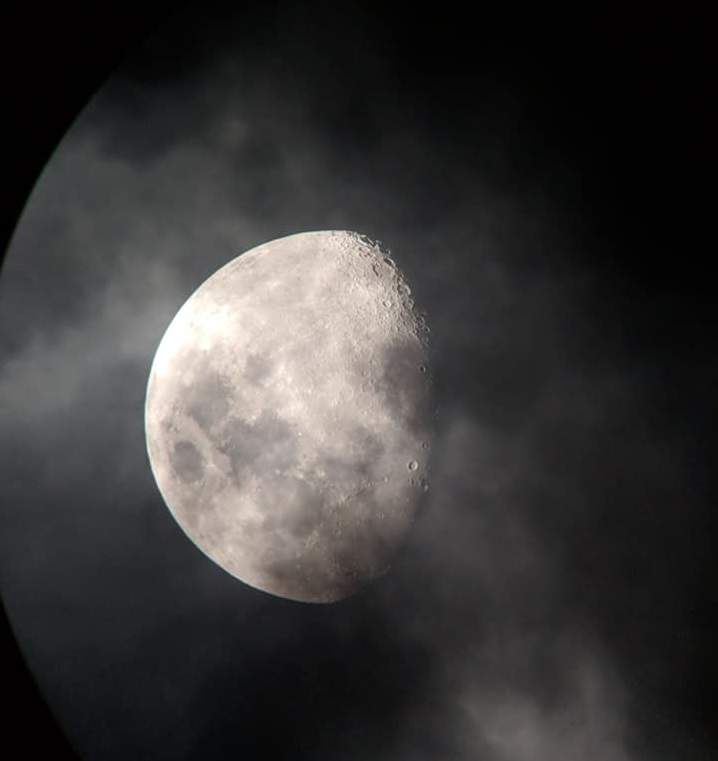 A picture of the moon taken through a telescope.