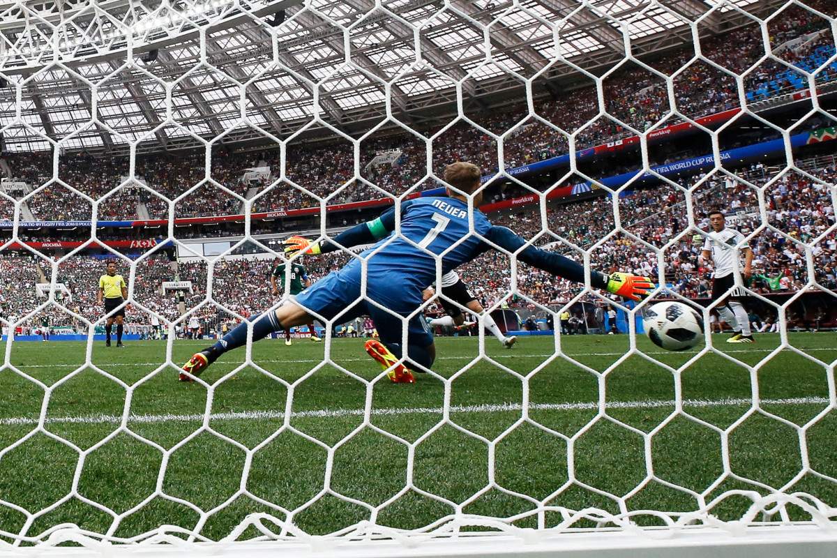 Manuel Neuer of Germany is beaten as Mexico go 1-0 up during the FIFA World Cup 2018 group F preliminary round soccer match between Germany and Mexico in Moscow.
