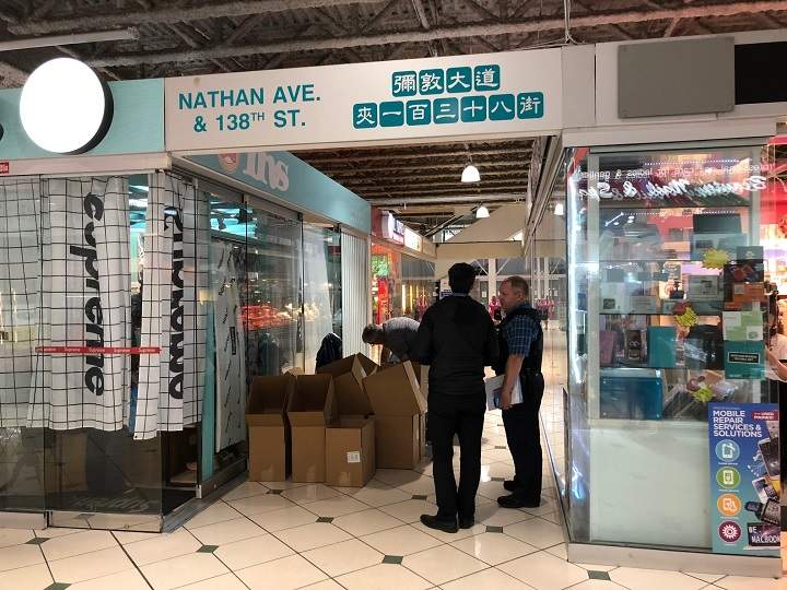 York Regional Police conduct raids at Pacific Mall in Markham, Ont., as part of a counterfeit goods investigation on June 27, 2018.