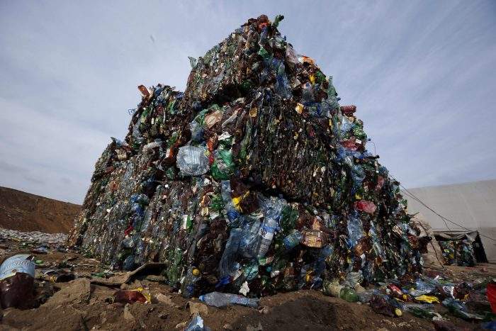 In this March 12, 2015 file photo, plastic trash is compacted into bales ready for further processing at the waste processing dump on the outskirts of Minsk, Belarus.