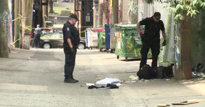 Police investigate a stabbing on Vancouver's Downtown Eastside on Saturday, June 23, 2018.
