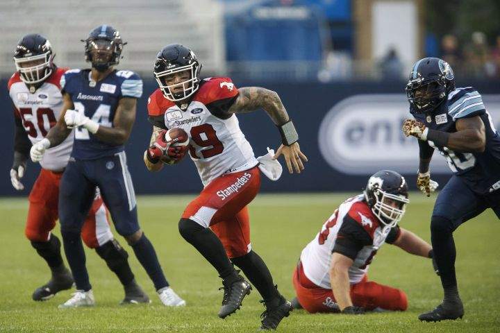 Calgary Stampeders quarterback Bo Levi Mitchell (19) rushes up field during the first half of CFL football game action against the Calgary Stampeders at BMO Field in Toronto, Ontario on Saturday June 23, 2018. 