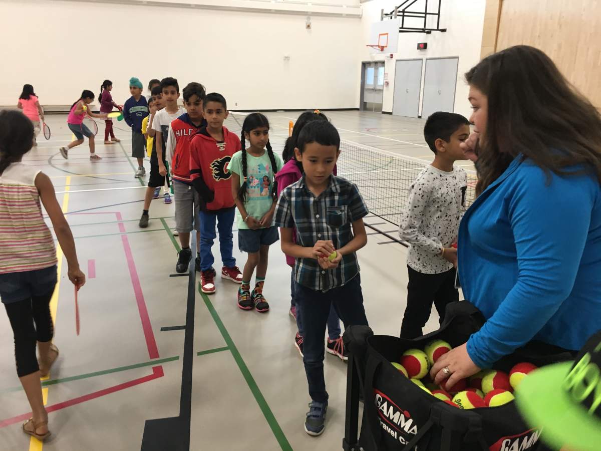 Grade 3 teacher Jennifer Wilson with her students at Hugh A. Bennett school in Calgary. June 22nd, 2018.
