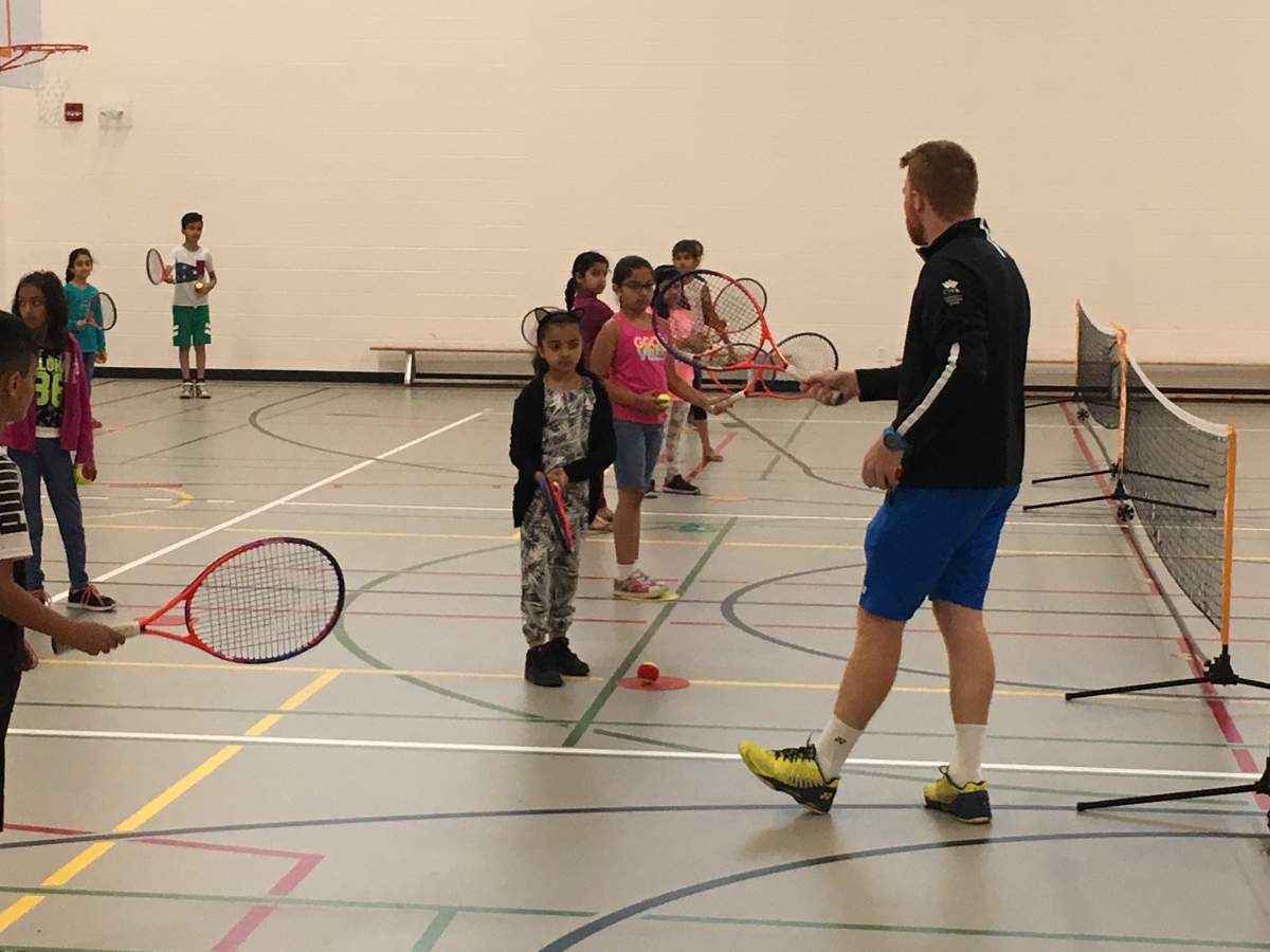 Grade 3 students at Hugh A. Bennett School in Calgary learning tennis. June 22nd, 2018.