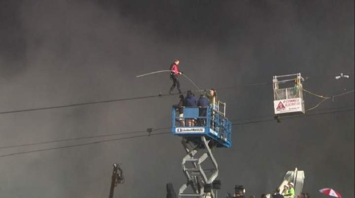 Nik Wallenda crossing Niagara Falls on a tightrope.
