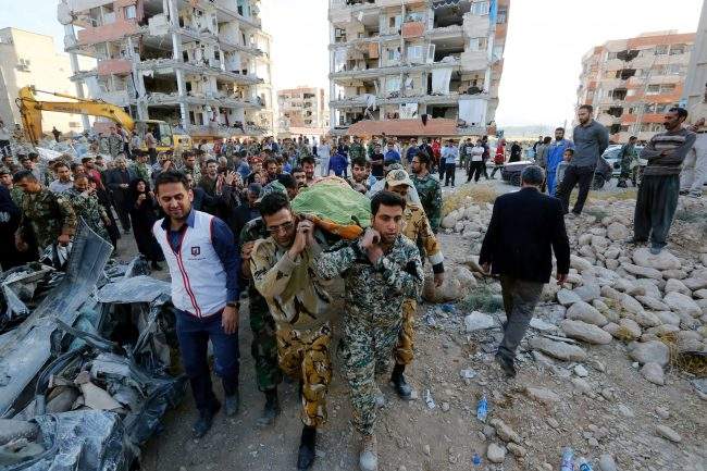 In this Nov. 13, 2017 file photo, Iranian soldiers carry the body of an earthquake victim in Kermanshah Province, Iran.


