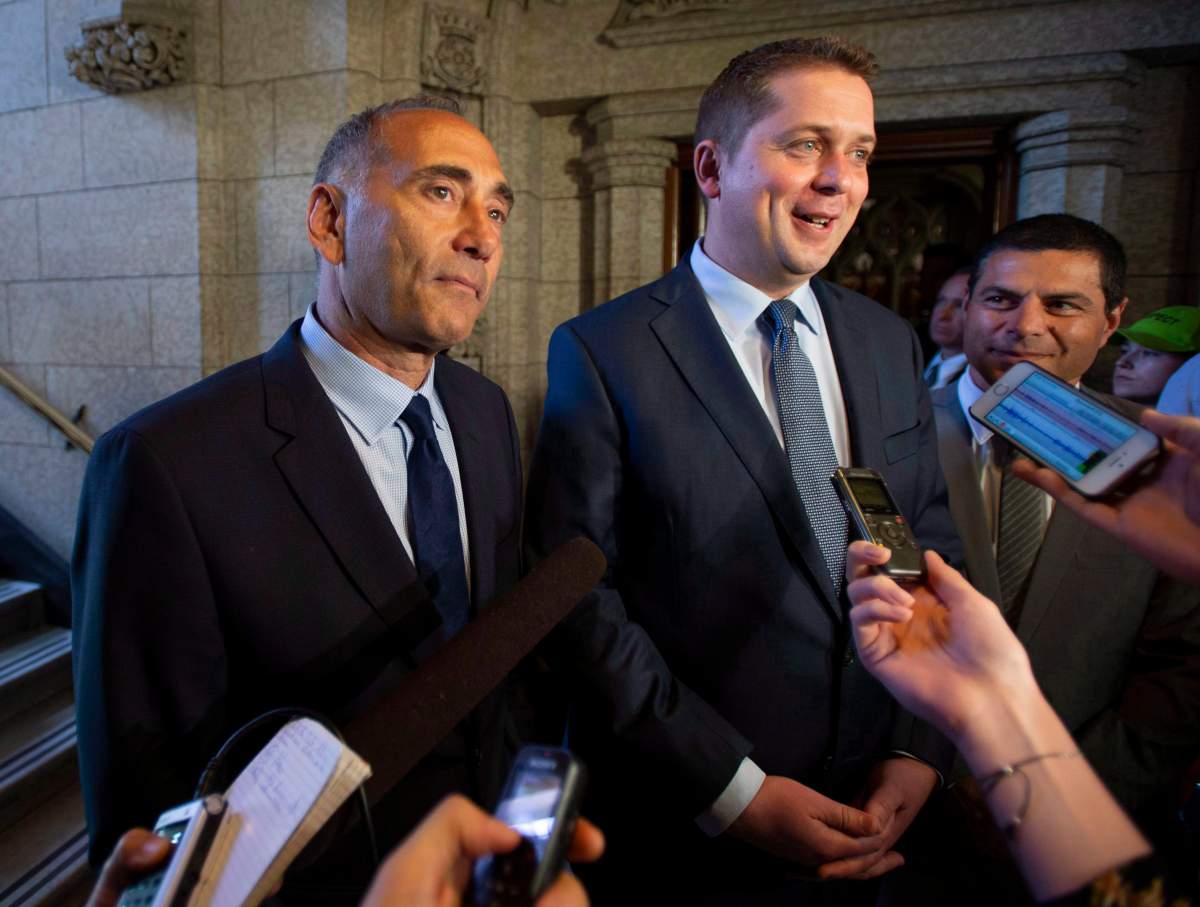 Conservative leader Andrew Scheer arrives with Richard Martel, who won the federal by-election in the riding of Chicoutimi-Le Fjord, before Question Period in the House of Commons on Parliament Hill in Ottawa on Wednesday, June 20, 2018.