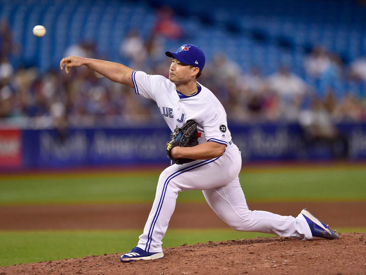 Toronto Blue Jays relief pitcher Seunghwan Oh (22) throws against the Detroit Tigers during eighth inning American League baseball action in Toronto on Friday, June 29, 2018. 