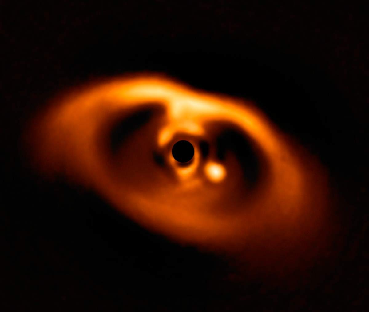 The photo provided by the European Southern Observatory ESO taken from the SPHERE instrument on ESO’s Very Large Telescope is the first clear image of a planet caught in the very act of formation around the dwarf star PDS 70.