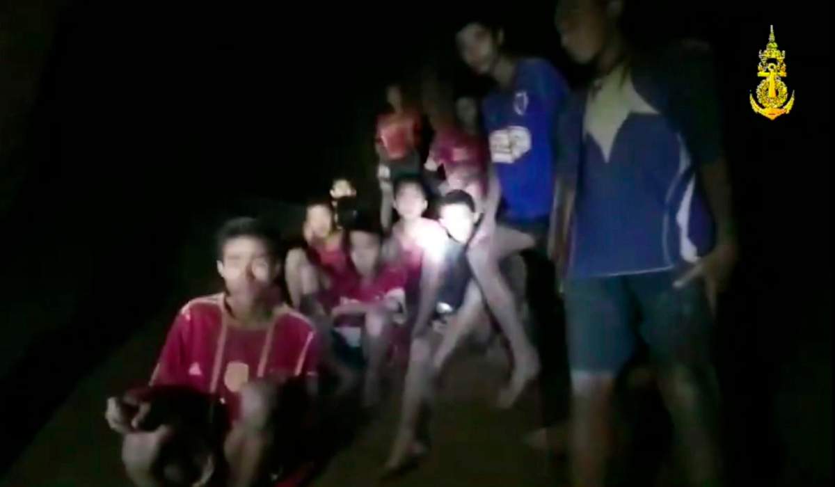 In this grab taken from video provided by the Thai Navy Seal, a view of the boys and their soccer coach as they are located in a cave, in Chiang Rai in Thailand, Monday, July 2, 2018.