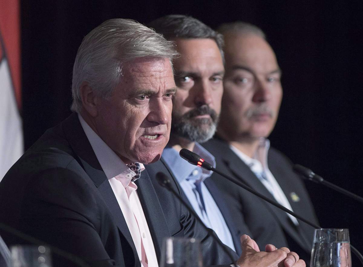 Newfoundland and Labrador Premier Dwight Ball, left, fields a question as Nunavut Premier Joe Savikataaq, right, and Yukon Premier Sandy Silver look on at the closing news conference of the Canadian premiers meeting in St. Andrews, N.B. on Friday, July 20, 2018.