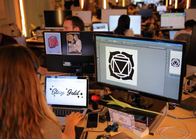 Staff at Inkbox, a temporary tattoo start-up, work on designs at their offices in Toronto, July 17, 2018.