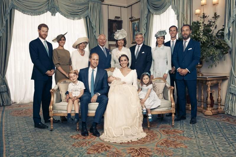 Seated, left to right: Prince George, Prince William, the Duke of Cambridge; Prince Louis; Kate, the Duchess of Cambridge; and Princess Charlotte. Standing, left to right: Prince Harry, The Duke of Sussex; Megan, the Duchess of Sussex; Camilla, the Duchess of Cornwall; Prince Charles, Prince of Wales; Carole Middleton, Michael Middleton, Pippa Matthews, James Matthews and James Middleton. (Matt Holyoak/Camera Press/Duke and Duchess of Cambridge via AP)