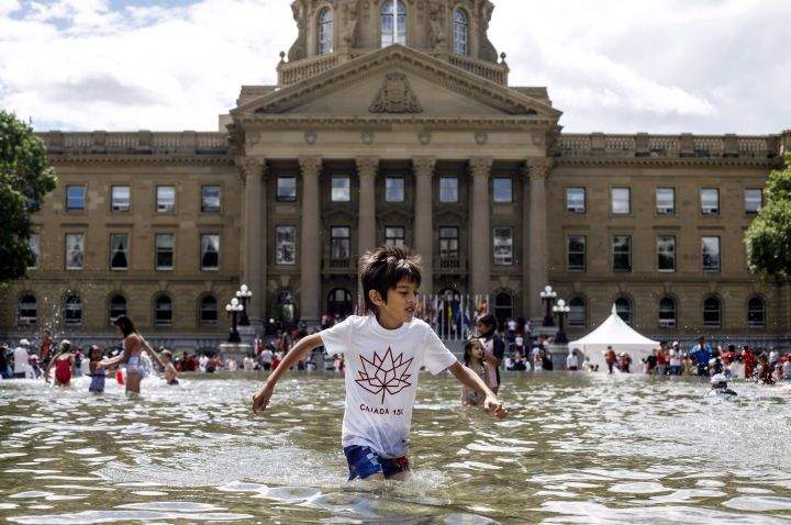 Kids stay cool in the pool during Canada day celebrations at the Alberta Legislature in Edmonton Alta, on Sunday July 1, 2018