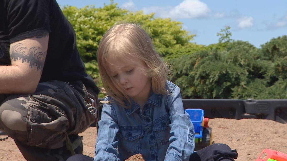 Nova Wamboldt plays at a playground in Liverpool, N.S.