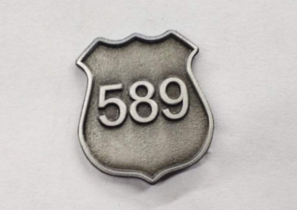 The commemorative pin Waterloo officers will be wearing throughout the month of August to honour David Nicholson.