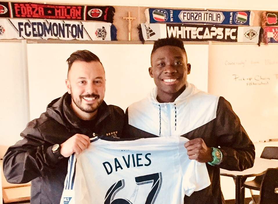 Alphonso Davies (right) is seen in a photo with Marco Bossio, who coached the soccer player at an Edmonton junior high school.